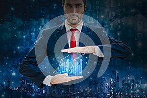 Businessman hands hold show glowing stock chart and graphs mock up business statistics,with night cityscape background and binary