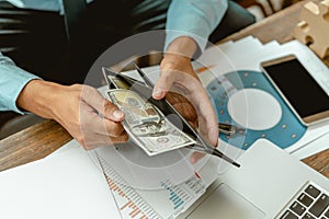 Businessman hands holding open wallet with money. business, finances and money concept