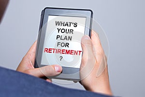 Businessman hands holding tablet with Whats Your Plan for Retire