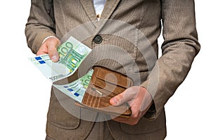 Businessman hands holding wallet with stack of money