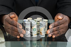 Businessman Hands Protecting Banknotes