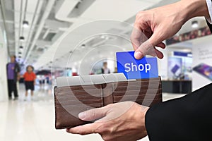 Businessman hands pulling money Shopping concept on brown wallet