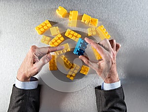 Businessman hands selecting the different piece for concept of priority