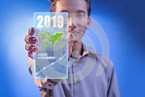 Businessman hands showing business target achievement in 2019 on