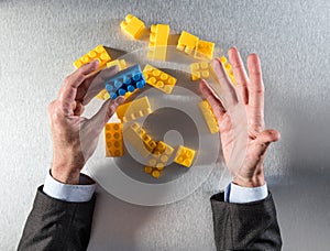 Businessman hands showing the odd one for concept of management