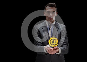 businessman with hands spread of with @ fire icon over. Black background