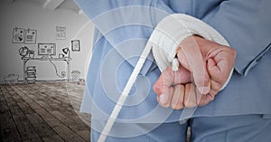 Businessman hands tied up with rope against graphic concept