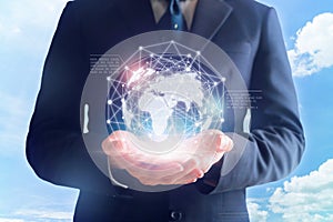 Businessman in hands touching digital global network.