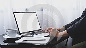 Businessman hands typing on computer laptop.