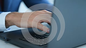 Businessman hands typing on keyboard laptop computer