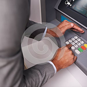 Businessman, hands and typing pin on ATM for banking, privacy or security at money machine. Closeup of man entering