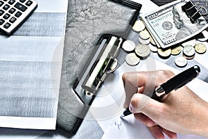 Businessman hands use calculator and financial data, analyze profit statistics on wooden table in office. Flat lay, top view. Conc