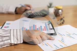 Businessman hands using calculator and cost at the office