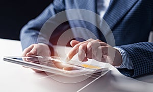 Businessman hands using tablet computer