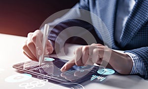 Businessman hands using tablet computer