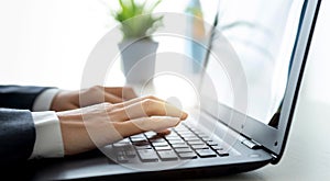 businessman hands working on laptop