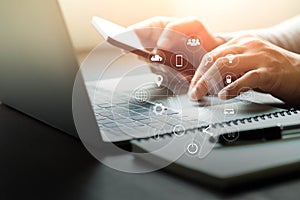 Businessman hands working with laptop computer on office desk.