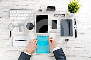 Businessman hands working at vintage wooden desk