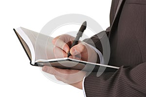 Businessman hands write in notepad
