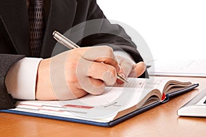 Businessman hands writing in organizer