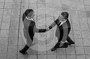 Businessman handshake with partner. Business men in suit shaking hands outdoors. Business idea. Business man