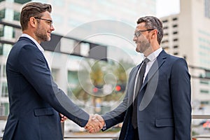 Businessman handshake with partner. Welcome business. Two businessmen shaking hands. Business men in suit shaking hands