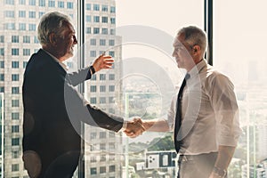 Businessman handshake for teamwork of business merger and acquisition