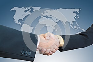 Businessman handshake with world map background