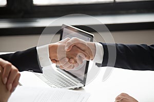 Businessman handshaking businesswoman showing respect, closeup v