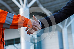 Businessman handshaking with worker