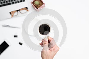 Businessman has holding black coffee cup to drinking on hard working in the morning. Businessman working with black coffee and co