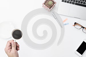 Businessman has holding black coffee cup to drinking on hard working in the morning. Businessman working with black coffee and co