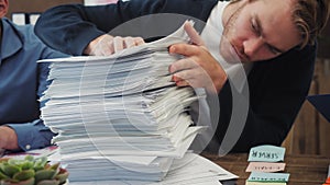 Businessman has too much paperwork