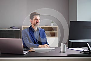 Businessman Having Ah Ha Moment While Working In Office photo