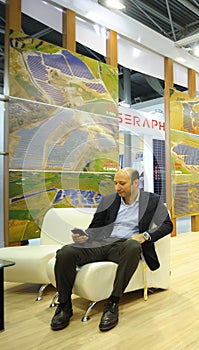 Businessman having break at the negotiating room during an exhibition. Kiev, Ukraine