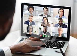 Businessman Having Business Meeting Making Video Call On Laptop Indoor