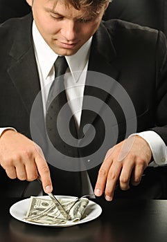 The businessman having dinner dollars