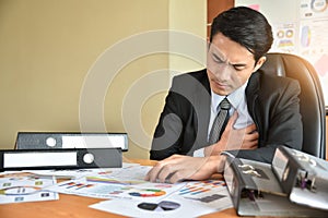 Businessman having heart attack.