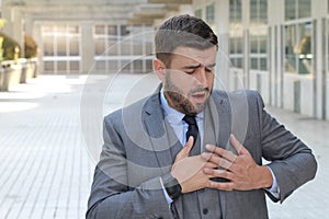 Businessman having a heart attack