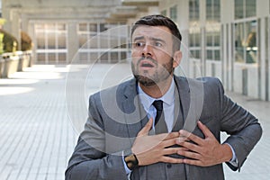 Businessman having a heart attack