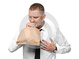 Businessman having panic attack on white background