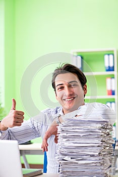 The businessman having problems with paperwork and workload