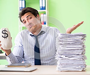 Businessman having problems with paperwork and workload