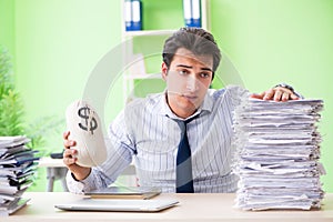 The businessman having problems with paperwork and workload