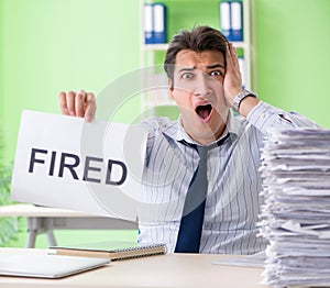 Businessman having problems with paperwork and workload