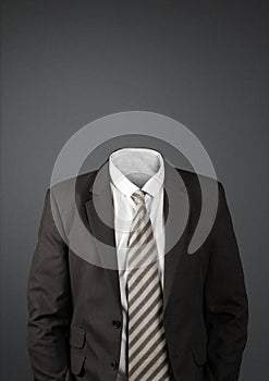 Businessman without head on dark with copy-space