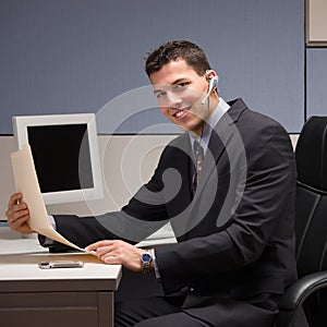 Businessman with headset working at desk