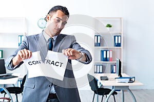 Businessman with heavy paperwork workload photo