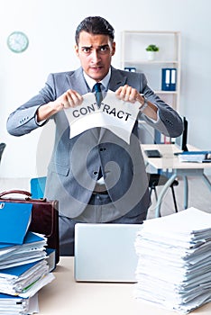 Businessman with heavy paperwork workload