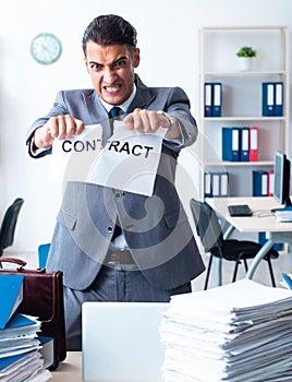 Businessman with heavy paperwork workload